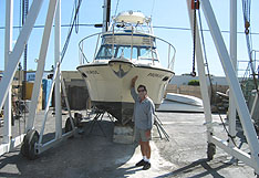 Brownie sanding a boat