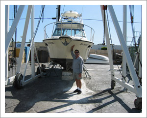 Brownie sanding a boat